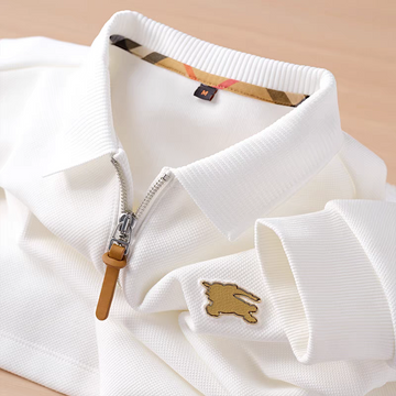 Embellished with a distinctive golden rabbit emblem on the chest